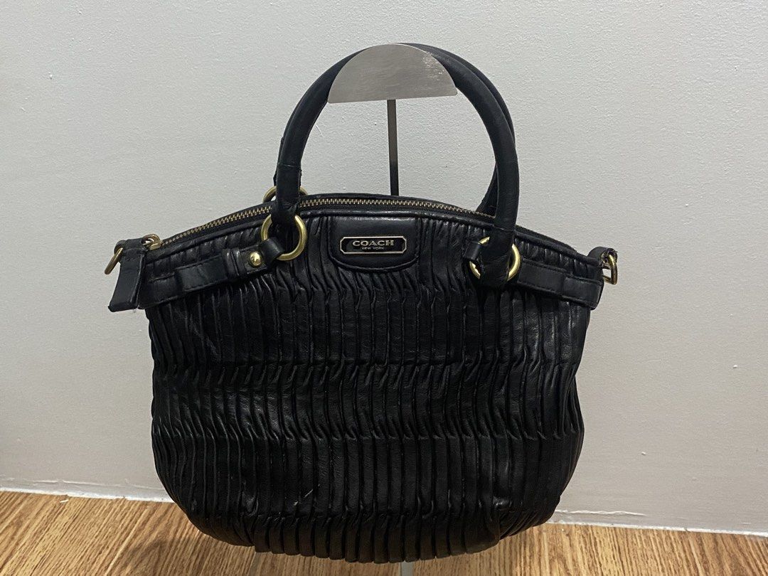 Coach Black 2way Bag (Category: Luxury Bags & Wallets) located in Davao. Submitted by ccfinds_ph (Listing ID 1464704039, Image 2). Description: Condition: Rank B - Good. Lightly used. Has light patina on antique gold hardware consistent with age. Leather is soft with natural creasing. Top handle with zip closure. Spacious interior fits essentials + iPad mini. With sling strap (check last pic).