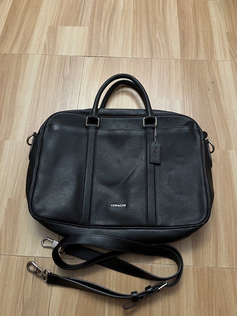 Coach Black Leather Briefcase With Shoulder Strap (Category: Briefcases) located in Victorias. Submitted by lan1877 (Listing ID 1464708152, Image 1). Description: - Brand: Coach - Material: Premium black leather with silver-tone hardware - Structure: Structured silhouette with dual top handles - Strap: Includes matching detachable and adjustable shoulder strap - Pockets: Front exterior slip pocket, interior zipper compartment, and classic Coach c