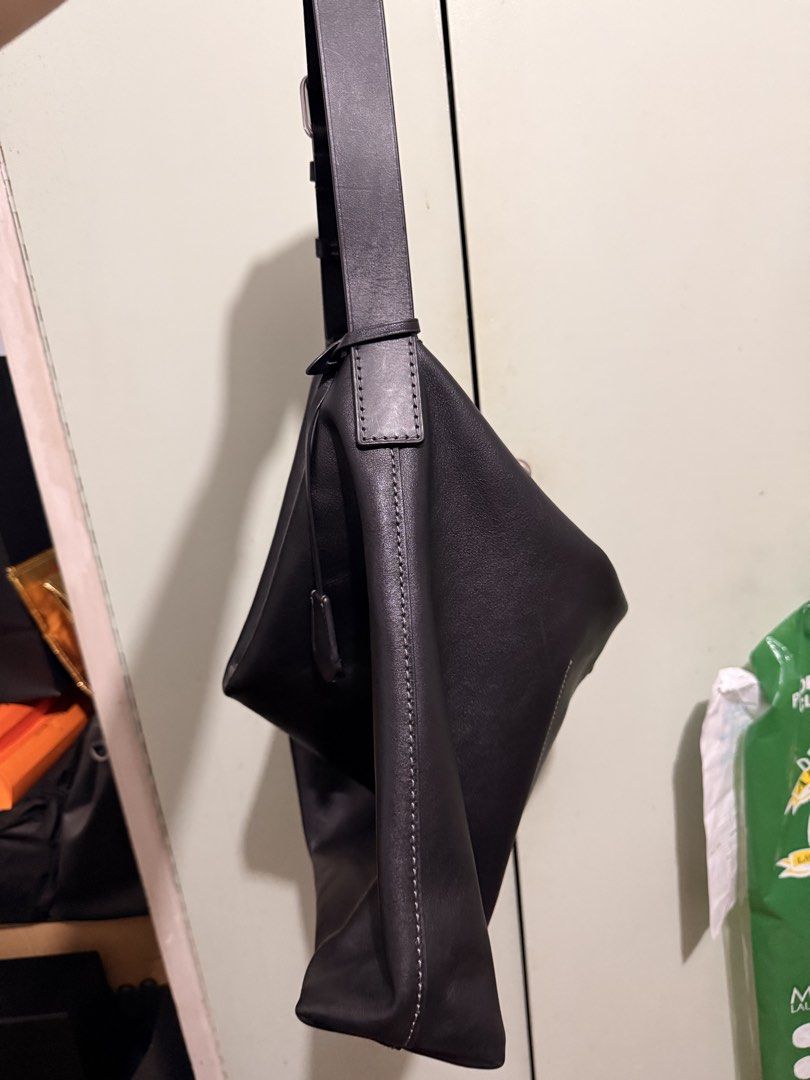 Coach Black Leather Shoulder Bag Hobo (Category: Luxury Bags & Wallets) located in San Juan City. Submitted by zenrabbit.6105c7 (Listing ID 1464691399, Image 3). Description: - Brand: Coach - Color: Classic black - Material: Genuine leather with slouchy drape - Hardware: Silver-tone zippers and accents - Strap: Adjustable with buckle - Features: Secure zip closure, open main compartment, and matching leather hangtag - Style: Minimalist and versat
