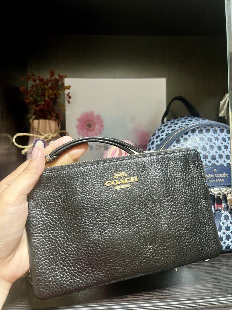Coach Black Pebbled Leather Double Zip Wallet (Category: Wallets & Card holders) located in Caloocan City. Submitted by ericavi_g (Listing ID 1464613418, Image 1). Description: Large Wristlet - Brand: Coach - Material: Black pebbled leather - Hardware: Gold-tone - Closure: Zip closure - Features: Detachable wrist strap - Interior: Spacious, fits essentials - Versatile: Ideal for everyday or nights out.