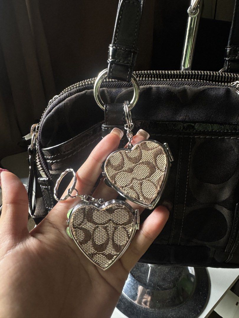 Coach Charm D.I.Y (Category: Luxury Bags & Wallets) located in Lagawe. Submitted by favorsnflavors69115 (Listing ID 1464631069, Image 1). Description: DIY project ✅AVAILABLE:Heart mirror charm with OG coach canvas print-350 ✅AVAILABLE: Crochet daisy with OG silver hangtag-299each.