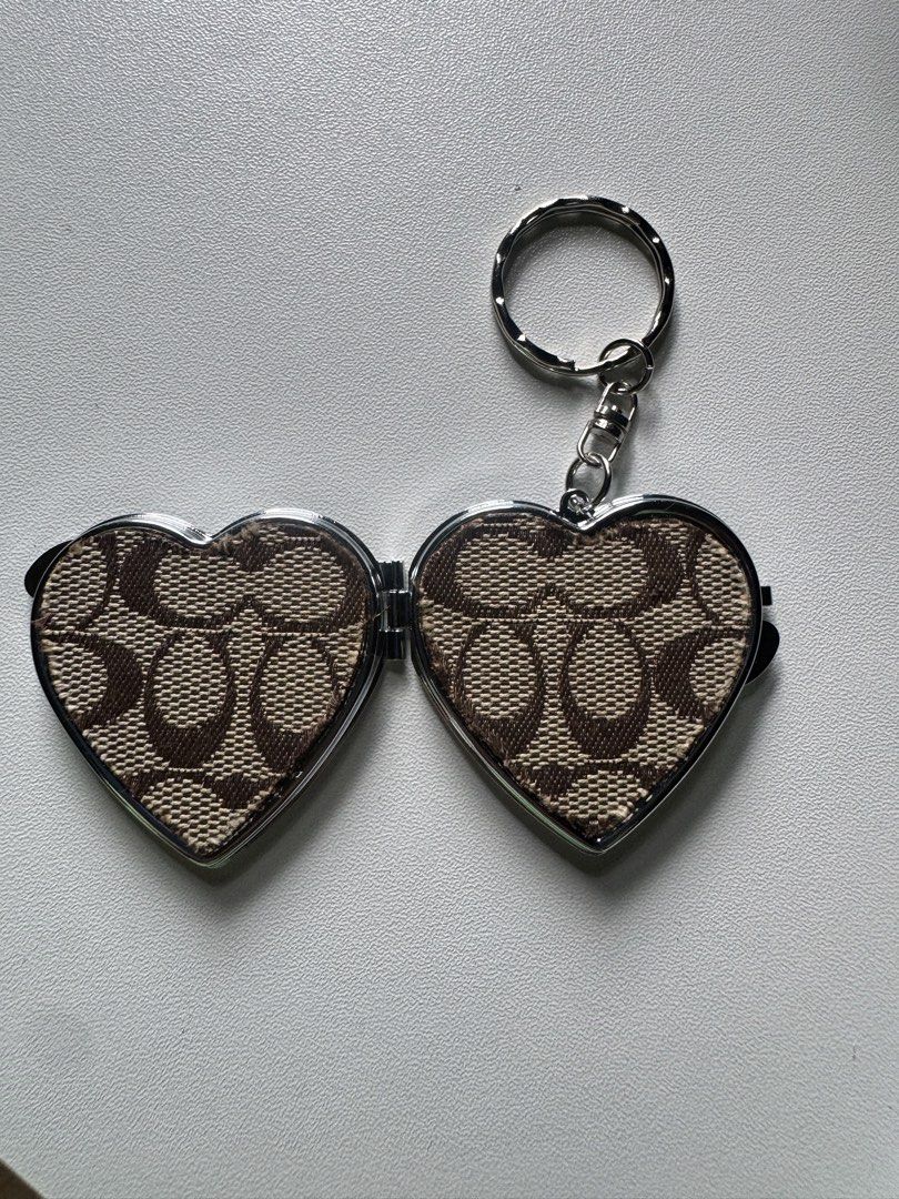 Coach Charm D.I.Y (Category: Luxury Bags & Wallets) located in Lagawe. Submitted by favorsnflavors69115 (Listing ID 1464631069, Image 2). Description: DIY project ✅AVAILABLE:Heart mirror charm with OG coach canvas print-350 ✅AVAILABLE: Crochet daisy with OG silver hangtag-299each.