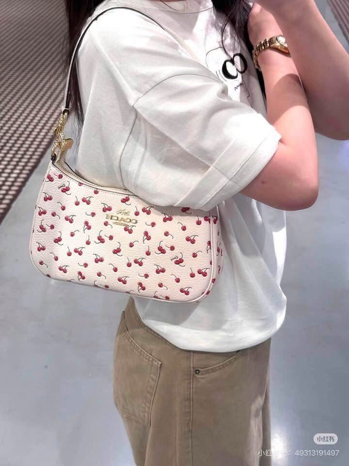 Coach cherry Terry (Category: Shoulder Bags) located in Manila. Submitted by gff.daily_flower (Listing ID 1464576902, Image 1). Description: With tag gift receipt dustbag and paperbag.