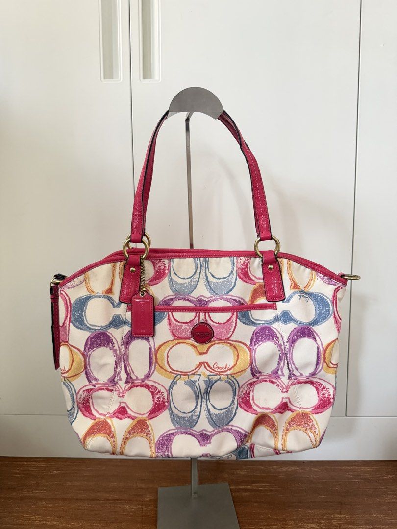 coach dark pink scribble logomania bag (Category: Luxury Bags & Wallets) located in Bulacan. Submitted by femalethings (Listing ID 1464663421, Image 1). Description: rare - flaws - stains bottom, minimal cracks on handle mop gcash bdo mod jnt loc bulacan.