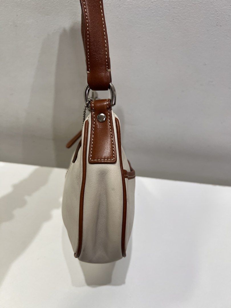 Coach Hampton Demi Y2K Baguette Bag (Category: Luxury Bags & Wallets) located in Cebu City. Submitted by brandedcorner_ph (Listing ID 1464726994, Image 3). Description: Pre-loved ((C))oach Hampton Demi Y2K Baguette Bag 100% Authentic or money back Condition • Excellent condition • No flaws Product Details •Color: White •Hardware: Silver tone •Material: Leather •Approximate Dimensions in inches: H5 x W9.5 x D2 Color may vary due to lighting. PM fo