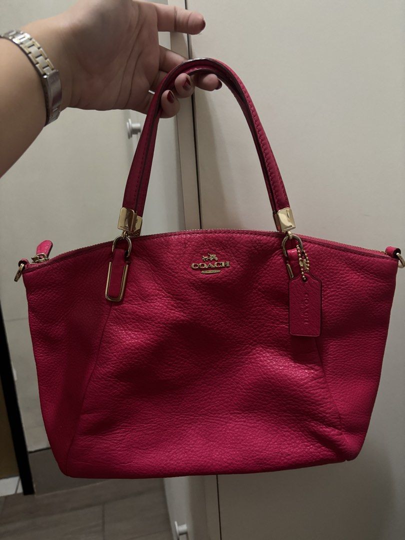 Coach Hot Pink Leather Bag (Category: Luxury Bags & Wallets) located in Manila. Submitted by estebannika35 (Listing ID 1464747660, Image 1). Description: - Authentic Coach leather bag in a vibrant bright pink shade - Luxurious gold hardware and signature Coach hangtag included - Secure top zip closure with comfortable dual shoulder straps - Durable pebbled leather texture - Medium size with plenty of room for your daily essentials - Impeccable co