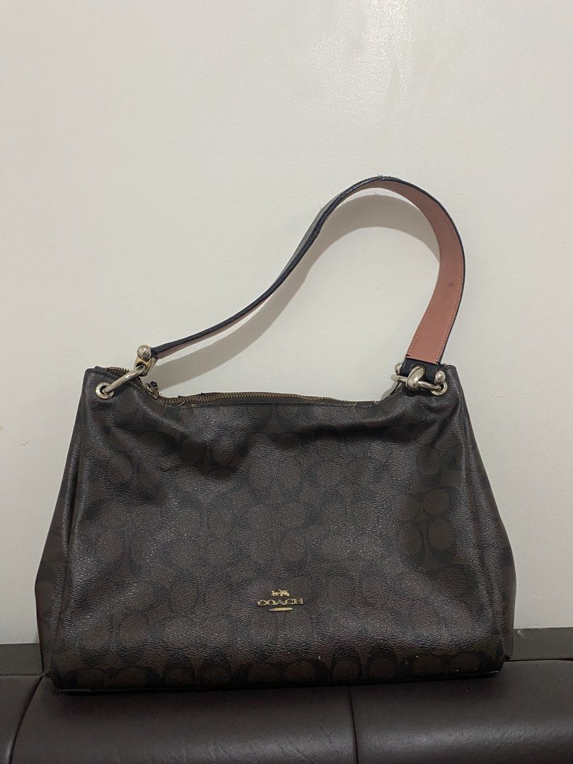 Coach Monogram Hobo Shoulder Bag (Category: Luxury Bags & Wallets) located in Manila. Submitted by stormiegray (Listing ID 1464652582, Image 1). Description: - Authentic brown Coach hobo bag - Signature monogram print - Leather strap with chain detail - Secure zipper closure - Interior pockets for organization - Minor signs of wear on zipper and interior lining.