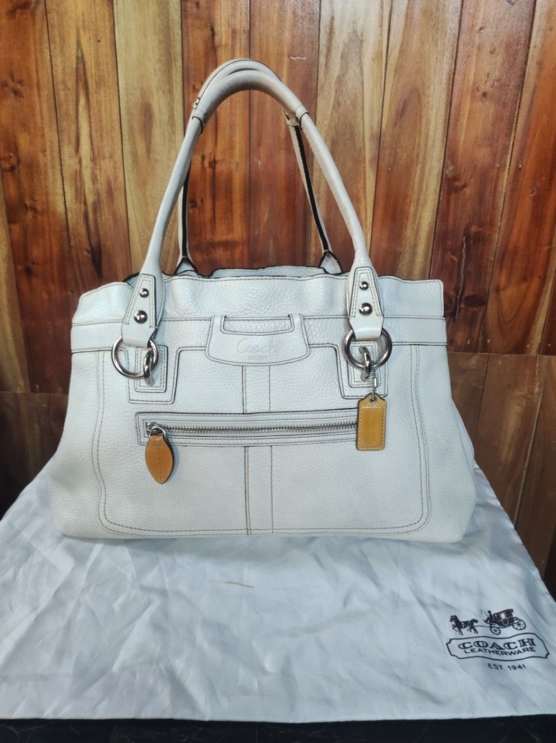 Coach Penelope (Category: Luxury Bags & Wallets) located in Naguilian. Submitted by a2aonlineshop (Listing ID 1464617195, Image 1). Description: style # : 13160 color: cream model: Coach Penelope Satchel/Tote Bag Manufactured Date: November, 2008 Material: Pebbled Leather with Satin Lining Features: 3 section compartment (magnetic snap button back & fort side & zipper in the middle), zipper pocket in front Inclusion: Dust Bag Flaw: light yellow s