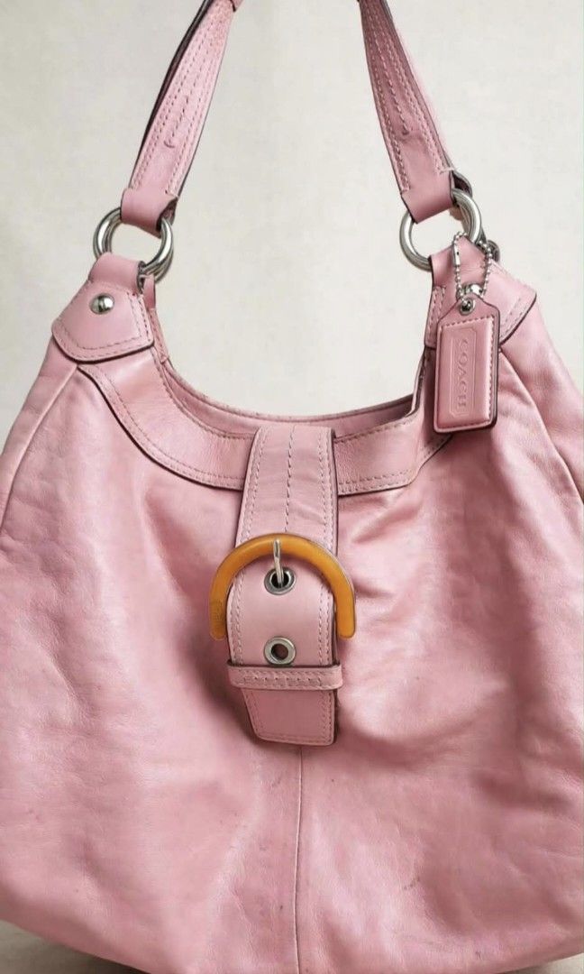 Coach Pink Leather Hobo Shoulder Bag (Category: Luxury Bags & Wallets) located in Cainta. Submitted by mariss.luxx (Listing ID 1464640182, Image 1). Description: - Genuine pink leather Coach hobo bag - Stylish buckle detail on the front - Interior zip pocket and small patch pocket - Ideal size for everyday essentials - Made in China.