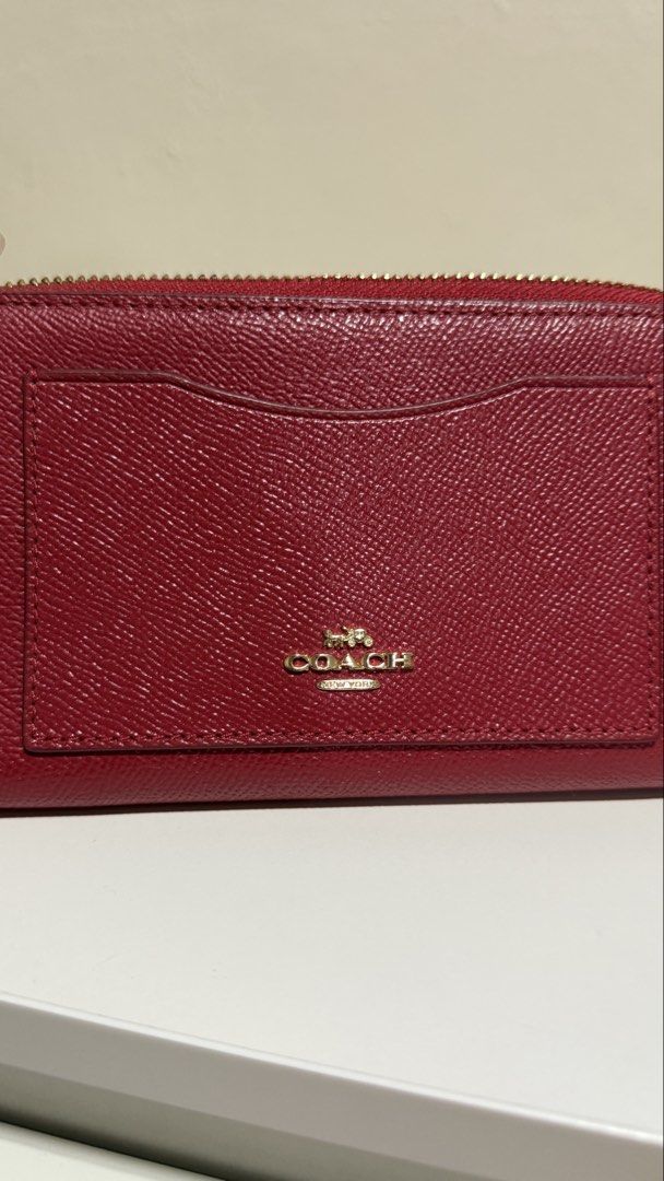 COACH Red Leather Accordion Zip Wallet (Category: Wallets & Card holders) located in Las Pinas. Submitted by afvilla9217 (Listing ID 1464577463, Image 2). Description: - Authentic Coach wallet in vibrant red leather - Secure zip-around closure - Convenient front slip pocket for quick access - Interior features multiple card slots for all your cards - Includes a zippered pocket for coins or small items - gold hardware accents - no other inclusions