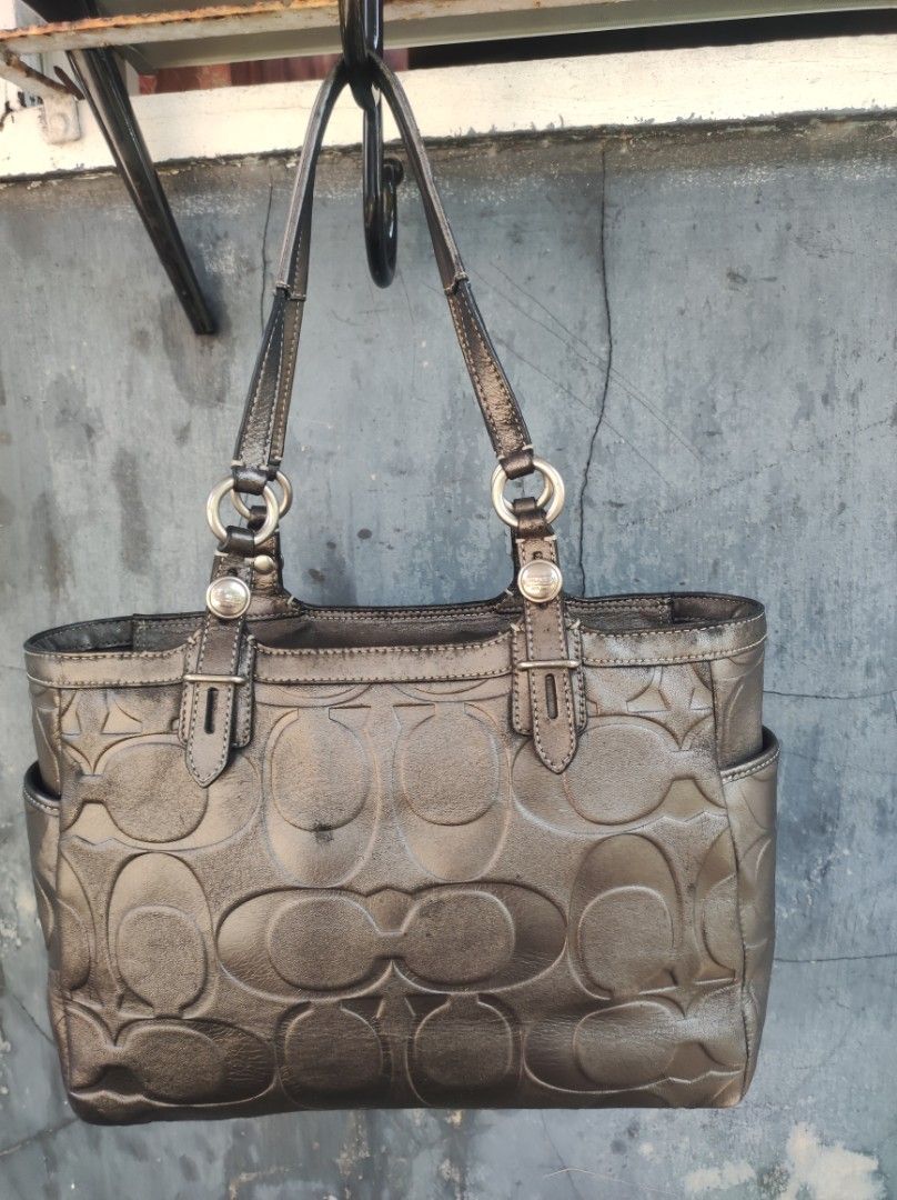 Coach Satchel Tote Bag (Category: Luxury Bags & Wallets) located in Naguilian. Submitted by a2aonlineshop (Listing ID 1464625028, Image 3). Description: Style: F15242 Color: Mettalic Charcoal Gray Material: Gunmetal Leather with an embossed signature C Size:11x9x3.5 inches (WxHxD) Issue: Discoloration, visible Po sa mga photos leather & rubber lining is in great condition, satin lining is neat..