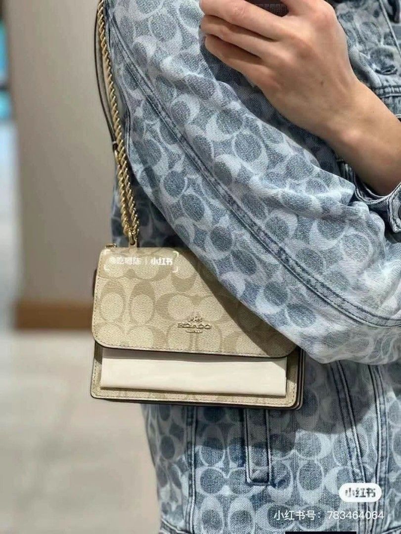 Coach Signature Canvas Chain Shoulder Bag (Category: Luxury Bags & Wallets) located in Pasig City. Submitted by farahoma15 (Listing ID 1464623689, Image 3). Description: - Authentic Coach bag - Signature C print in khaki and black - Gold chain strap - Comes with dust bag and box - Perfect for day or night wear - Very chic and versatile.
