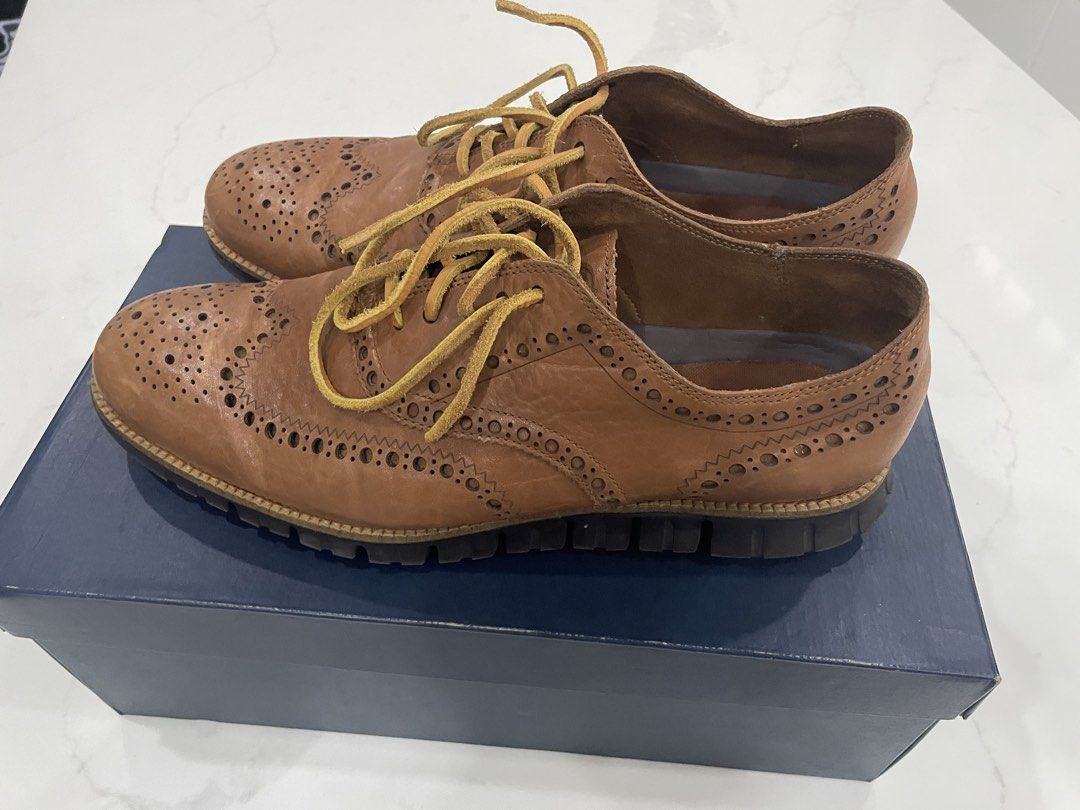 Cole Haan Zerogrand Wingtip Oxfords size 11.5US (Category: Dress Shoes) located in Pateros City. Submitted by dunhillmenthols (Listing ID 1464652398, Image 2). Description: - Brand: Cole Haan - Model: Zerogrand - Style: Wingtip Oxfords - Material: Brown Leather - Closure: Lace-up - Sole: Unique segmented design for comfort and flexibility - Occasion: Smart casual, business casual - Includes: Original box.
