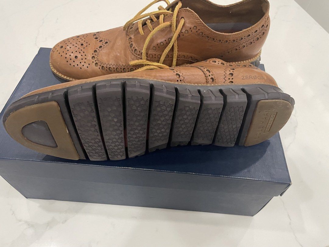Cole Haan Zerogrand Wingtip Oxfords size 11.5US (Category: Dress Shoes) located in Pateros City. Submitted by dunhillmenthols (Listing ID 1464652398, Image 3). Description: - Brand: Cole Haan - Model: Zerogrand - Style: Wingtip Oxfords - Material: Brown Leather - Closure: Lace-up - Sole: Unique segmented design for comfort and flexibility - Occasion: Smart casual, business casual - Includes: Original box.