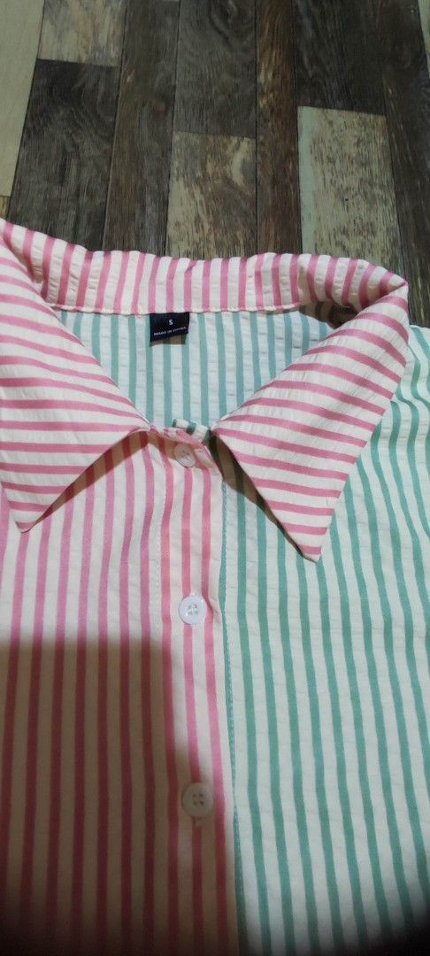 Colorblock Striped Button-Up Shirt (Category: Shirts) located in Quezon City. Submitted by tintinarms (Listing ID 1464620120, Image 3). Description: - Cute colorblock shirt with vertical stripes - Features pink, green, yellow, and blue panels - Button-up front with a collar - Long sleeves with button cuffs - Ideal for a casual look -loose type, malaki ang sizing nya..
