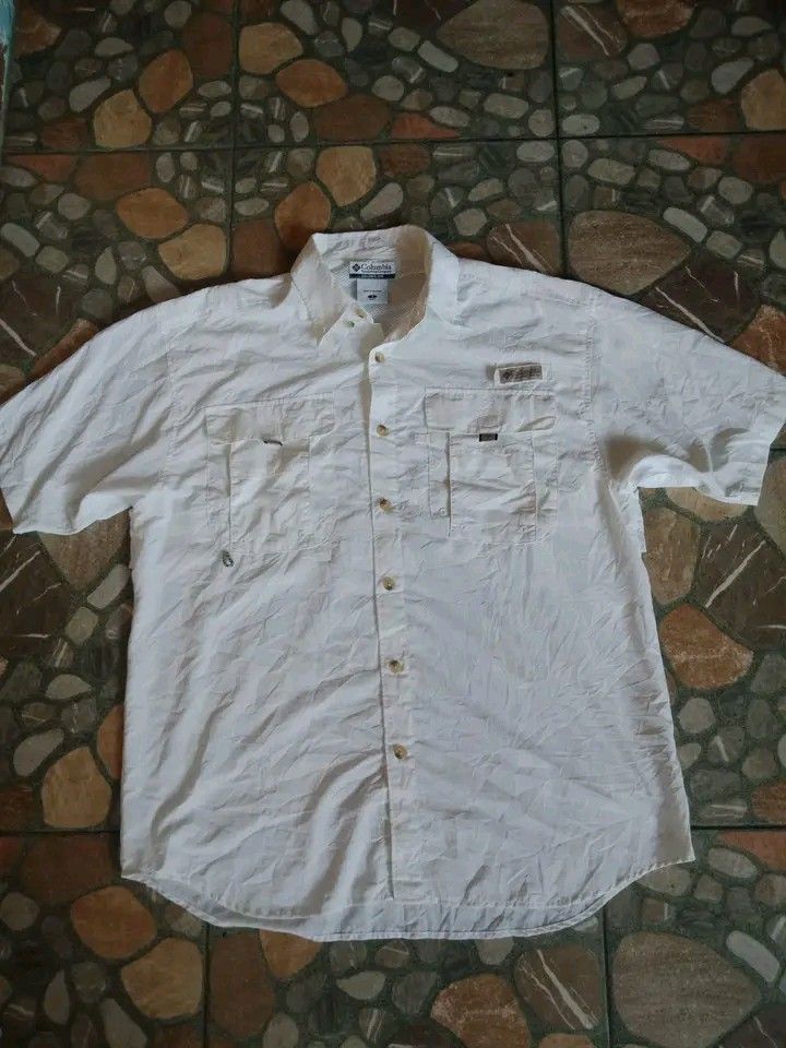 Columbia PFG button down Short Sleeve Polo. (Category: Other Sports Equipment and Supplies) located in Dasmarinas. Submitted by francoprancisco (Listing ID 1464662817, Image 1). Description: Columbia PFG button down Short Sleeve Polo. Large 22 x 28.5 dimes. quickdry/lightweight.back vented. white na white. no flaws no issue. 550 plus sfee..