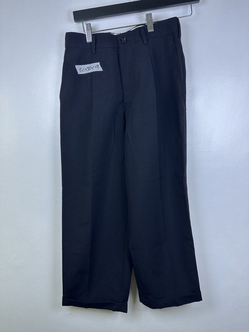 COMME des GARÇONS NOIR Pants SS (Category: Trousers) located in Manila. Submitted by declutterpromax (Listing ID 1464619288, Image 1). Description: - Brand: COMME des GARÇONS NOIR - Color: Black - Size: SS - Material: 100% Wool (Outer), 100% Cupra (Lining) - Closure: Button and Zip - Style: Classic trousers, suitable for both formal and casual occasions. - Details: Refer to tags for more information..