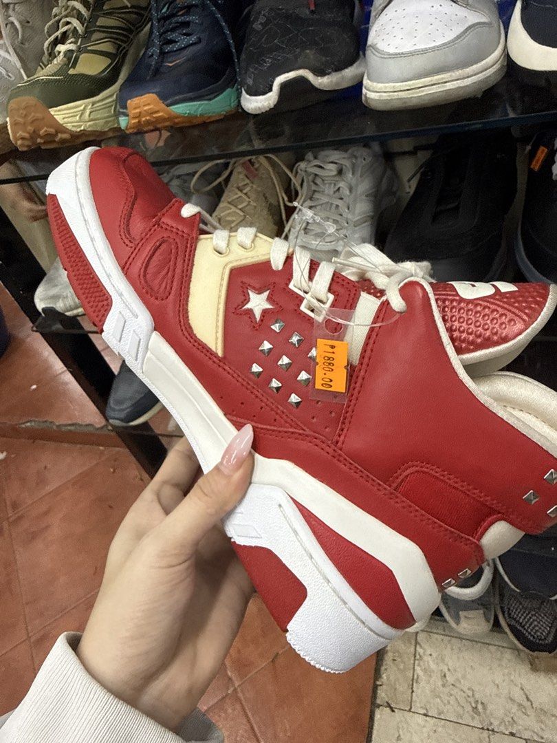 Converse CONS Red White Studded High Top Sneakers (Category: Sneakers) located in Manila. Submitted by fastlion.584bdf (Listing ID 1464732477, Image 3). Description: - Brand/Model: Converse CONS - Color: Red and white with metal stud details on the side and heel - Style: High top with chunky sole and white laces - Size: Men's 8 / Women's 9.5 / EUR 41 / 260 mm - Materials: Leather upper, textile lining, rubber outsole - Origin: Made in Vietnam.