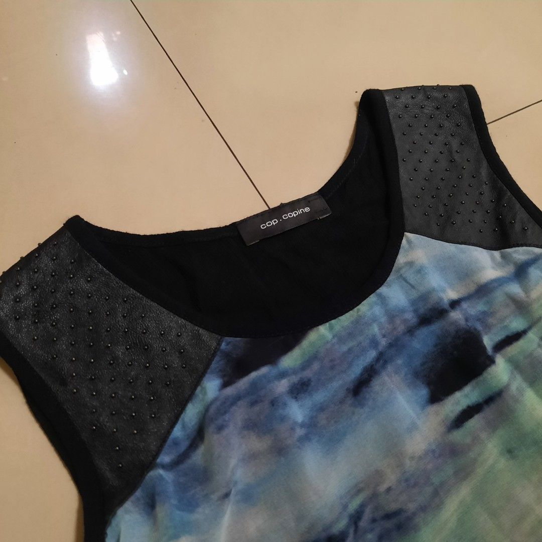 Cop Copine Graphic Mesh Print (Category: Sleeveless) located in Cebu City. Submitted by archivalia.me (Listing ID 1464578905, Image 2). Description: Cop Copine Graphic Mesh Print Leather Details Top Small Width 15 Length 27 Good as New No Issue Price dm + sf Loc: Cebu City .