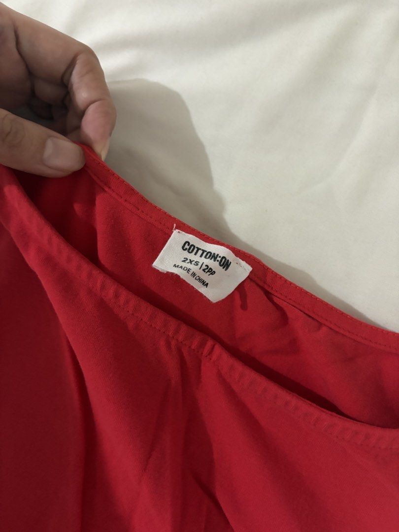 Cotton On Red Sleeveless Dress (Category: Dresses) located in Quezon City. Submitted by floresdette (Listing ID 1464708382, Image 2). Description: - Brand: Cotton On - Used once - Style: Sleeveless with a classic crew neckline - Length: Mid-thigh - Material: Soft and comfortable stretch cotton - Size: 2XS but fits Small. I am size 26 waistline - Condition: Great for quick, effortless casual daytime outfits.