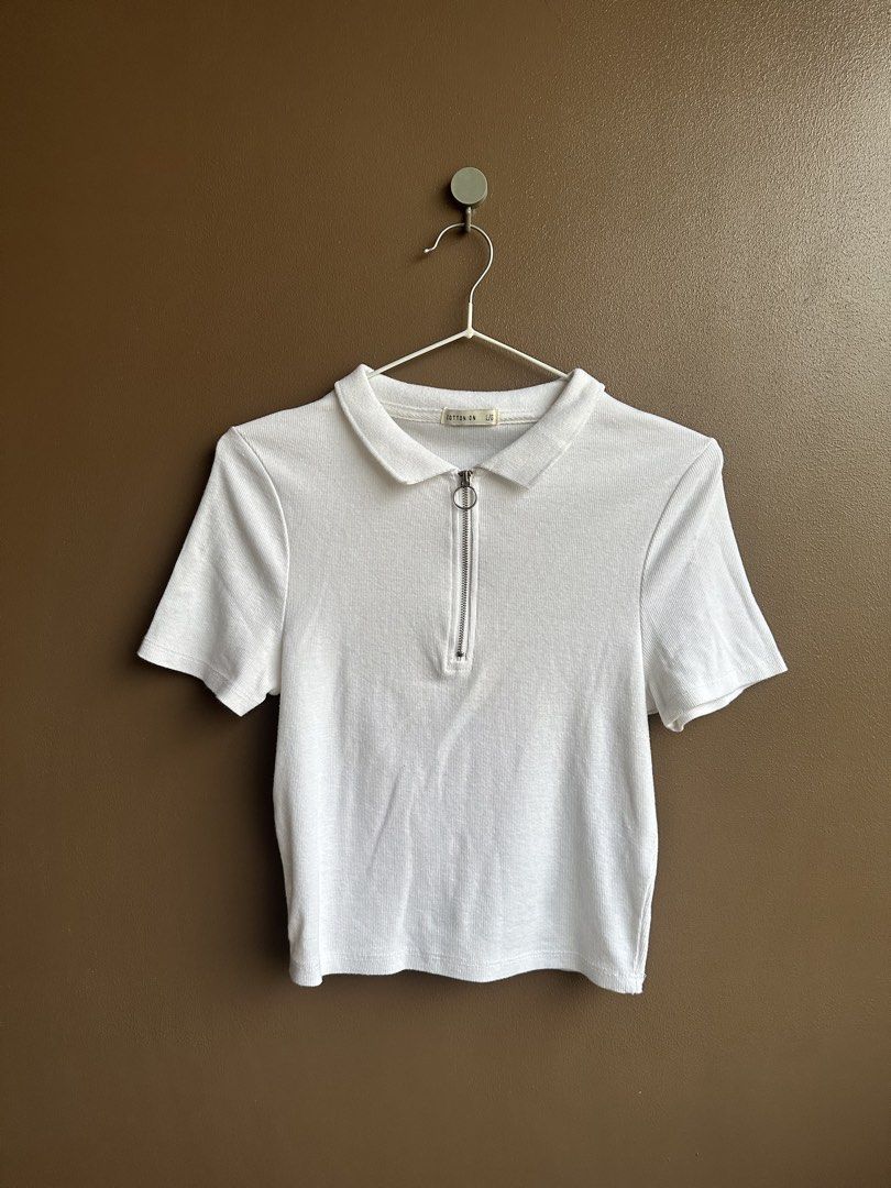Cotton On White Ribbed Zip Polo Crop Top (Category: Shirts) located in Pasig City. Submitted by afterglowpreloved (Listing ID 1464722385, Image 1). Description: .