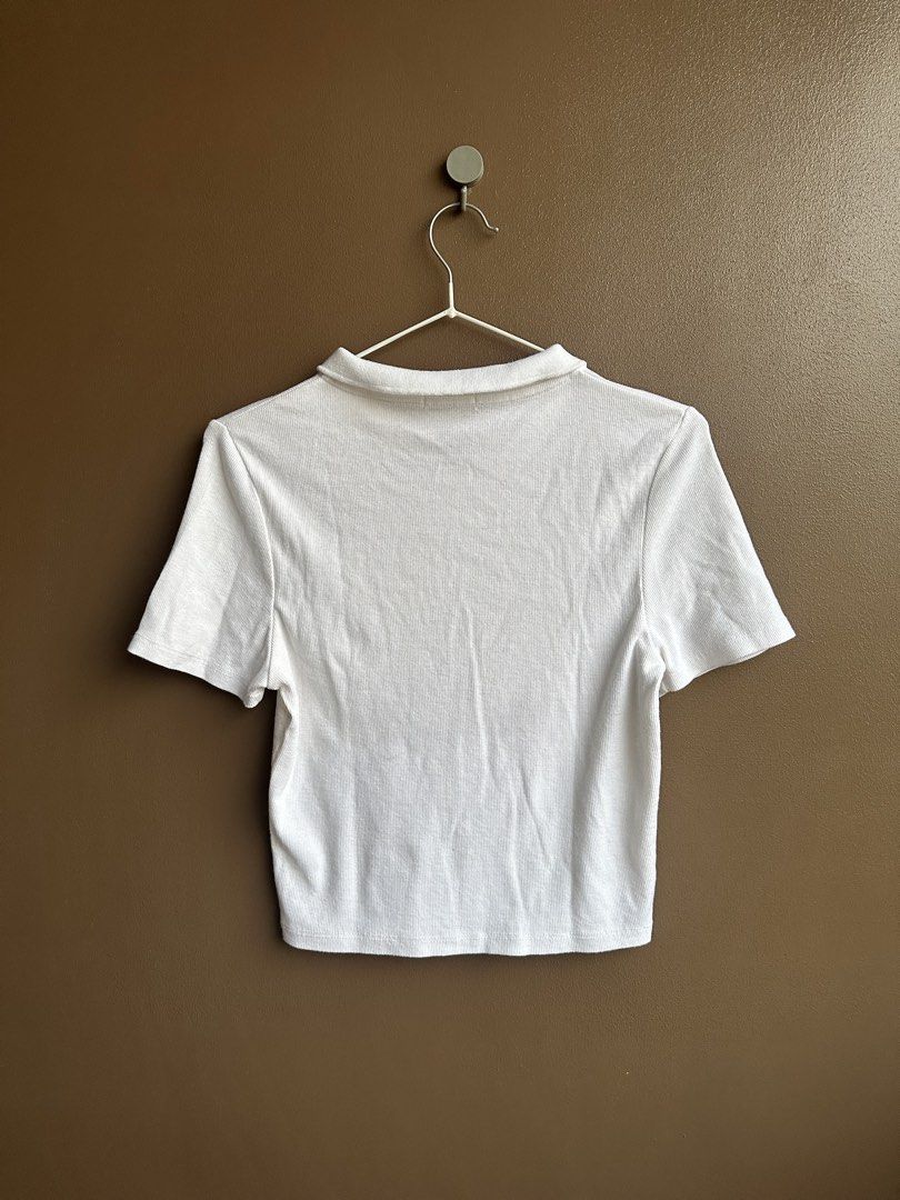 Cotton On White Ribbed Zip Polo Crop Top (Category: Shirts) located in Pasig City. Submitted by afterglowpreloved (Listing ID 1464722385, Image 3). Description: .