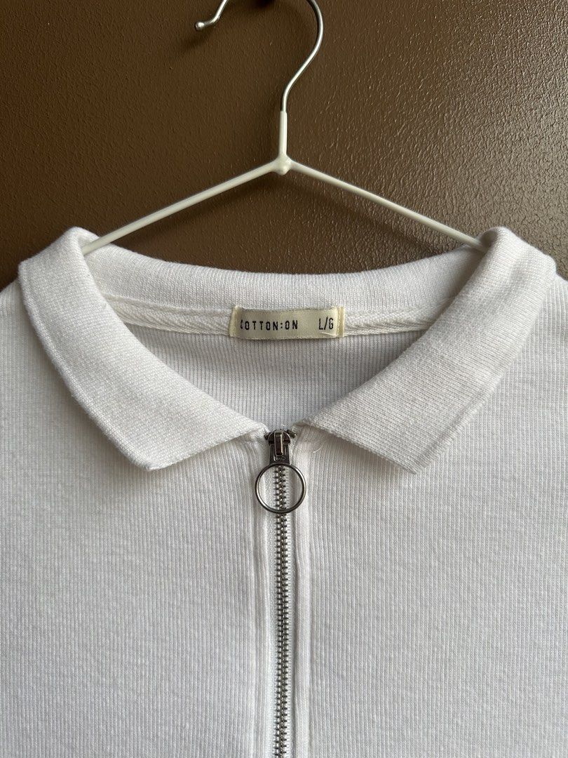 Cotton On White Ribbed Zip Polo Crop Top (Category: Shirts) located in Pasig City. Submitted by afterglowpreloved (Listing ID 1464722385, Image 2). Description: .