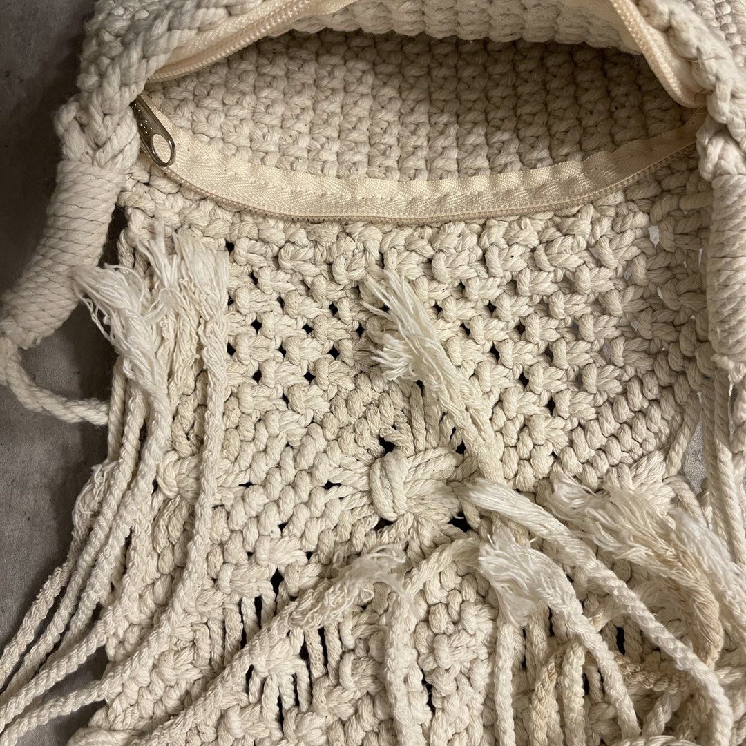 Cream Macrame Crossbody Bag with Fringe (Category: Cross-body Bags) located in General Trias. Submitted by 1992thelabel (Listing ID 1464697453, Image 2). Description: 🐶🐱Proceeds go to my rescue dogs, cats & strays. Your purchase would mean a lot! Thank you 🐾 Cream-coloured handmade macrame crossbody bag. Intricate knot pattern on the front flap and long fringe hanging down. Solid crochet-style knit on the back side. Cream zipper closure runnin