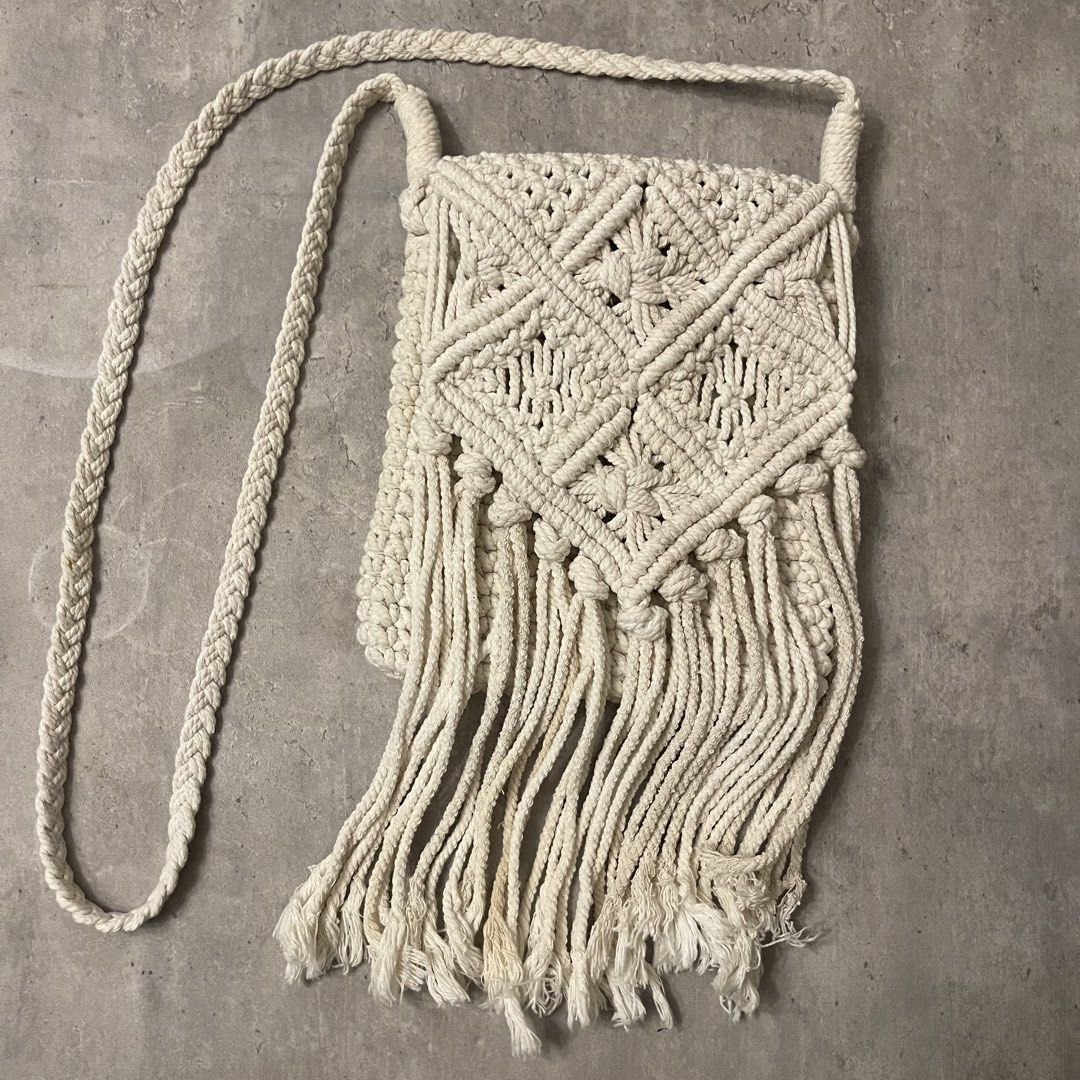Cream Macrame Crossbody Bag with Fringe (Category: Cross-body Bags) located in General Trias. Submitted by 1992thelabel (Listing ID 1464697453, Image 1). Description: 🐶🐱Proceeds go to my rescue dogs, cats & strays. Your purchase would mean a lot! Thank you 🐾 Cream-coloured handmade macrame crossbody bag. Intricate knot pattern on the front flap and long fringe hanging down. Solid crochet-style knit on the back side. Cream zipper closure runnin