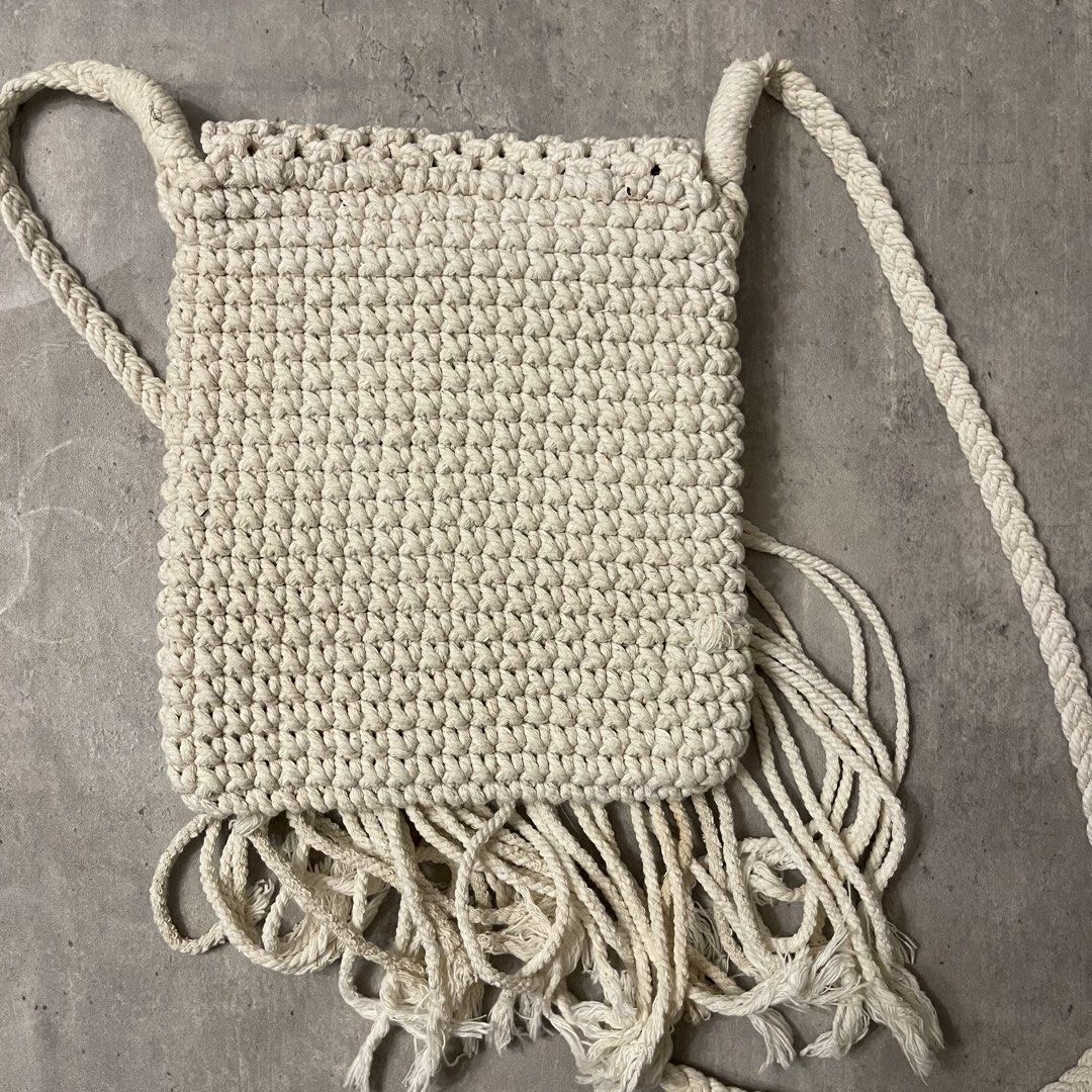 Cream Macrame Crossbody Bag with Fringe (Category: Cross-body Bags) located in General Trias. Submitted by 1992thelabel (Listing ID 1464697453, Image 3). Description: 🐶🐱Proceeds go to my rescue dogs, cats & strays. Your purchase would mean a lot! Thank you 🐾 Cream-coloured handmade macrame crossbody bag. Intricate knot pattern on the front flap and long fringe hanging down. Solid crochet-style knit on the back side. Cream zipper closure runnin
