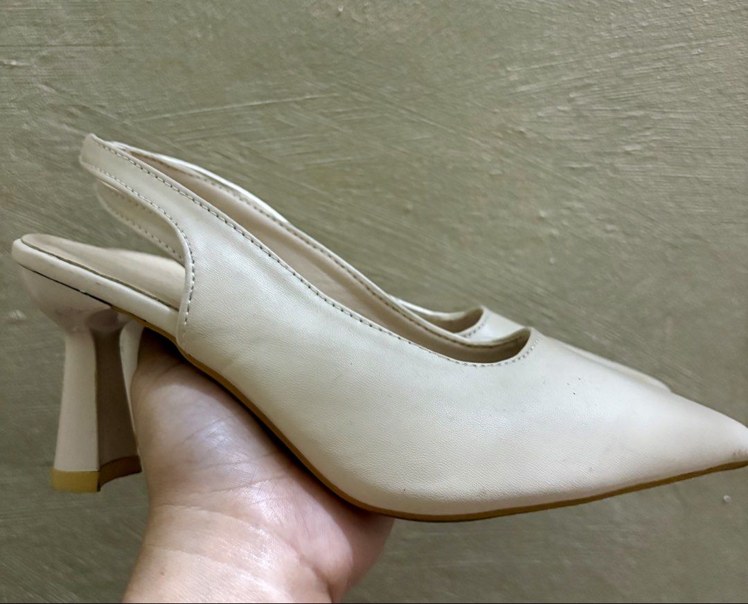 Cream Slingback Heels (Category: Heels) located in Caloocan City. Submitted by stella_mari27 (Listing ID 1464652399, Image 2). Description: - Cream slingback heels - Pointed toe design - Chunky heel for comfort and style - Easy slip-on style - Versatile for dressing up or down - Goes with many outfits.