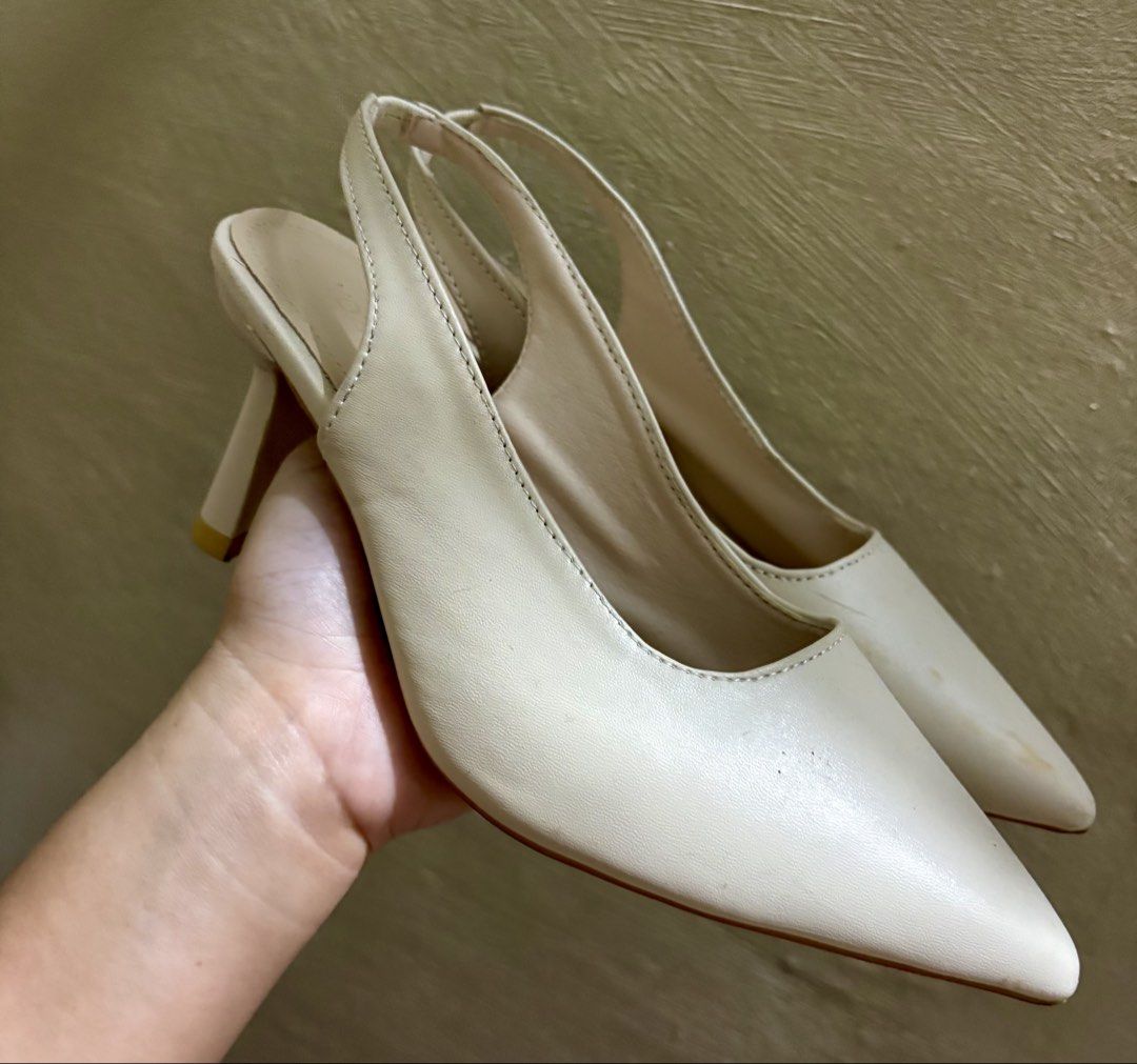Cream Slingback Heels (Category: Heels) located in Caloocan City. Submitted by stella_mari27 (Listing ID 1464652399, Image 1). Description: - Cream slingback heels - Pointed toe design - Chunky heel for comfort and style - Easy slip-on style - Versatile for dressing up or down - Goes with many outfits.