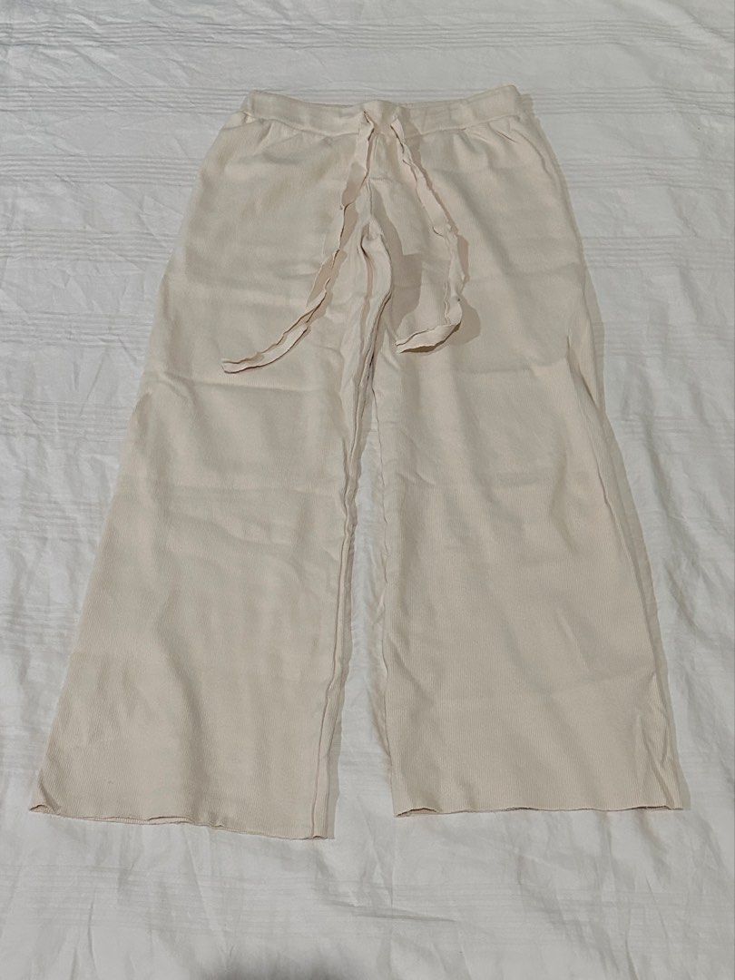 Cream Wide Leg Pants with Drawstring Waist (Category: Jeans) located in Quezon City. Submitted by gentle_le (Listing ID 1464596131, Image 1). Description: - has dark dot stain/s - Adjustable drawstring waist for a perfect fit - Subtle ribbed texture on the fabric - Trendy raw hem detail - Comfortable and casual style Original price: ₱264.