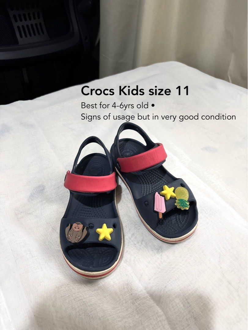 Crocs Kids Size 11 (4-6 yrs old) (Category: Babies & Kids Fashion) located in Calamba. Submitted by marbautista (Listing ID 1464632979, Image 1). Description: - Navy blue Crocs with Jibbitz charms, size 11. - Suitable for children aged 3-6 years old. - Durable, ideal for daily wear and playtime Visible signs of usage, but in very good condition.