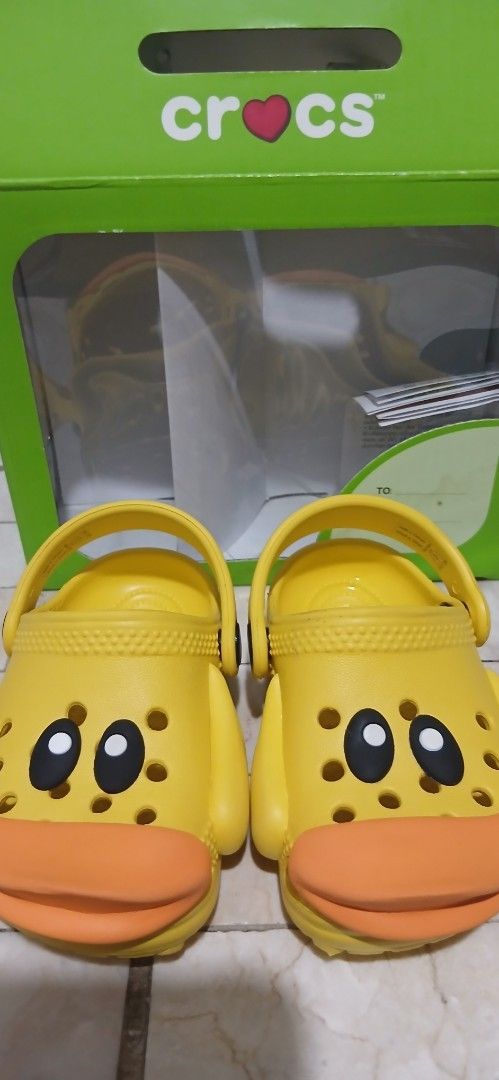 crocs littles iam rubber ducky (Category: Babies & Kids Fashion) located in Caloocan City. Submitted by rame_finds (Listing ID 1464679395, Image 1). Description: - Adorable yellow Crocs for kids - Features a fun dog face design with orange ears - Easy slip-on and off for little feet - Ideal for playful children - Includes original Crocs box.