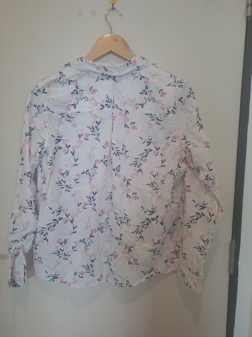 Cropt & Barrow longsleve (Category: Longsleeves) located in Manila. Submitted by joanbalde39643 (Listing ID 1464666430, Image 3). Description: This is a Croft & Barrow floral button-down shirt featuring a white base with a delicate pink and navy blue branch and leaf print. It is designed with long sleeves, buttoned cuffs, a standard point collar, and a small left-chest patch pocket..