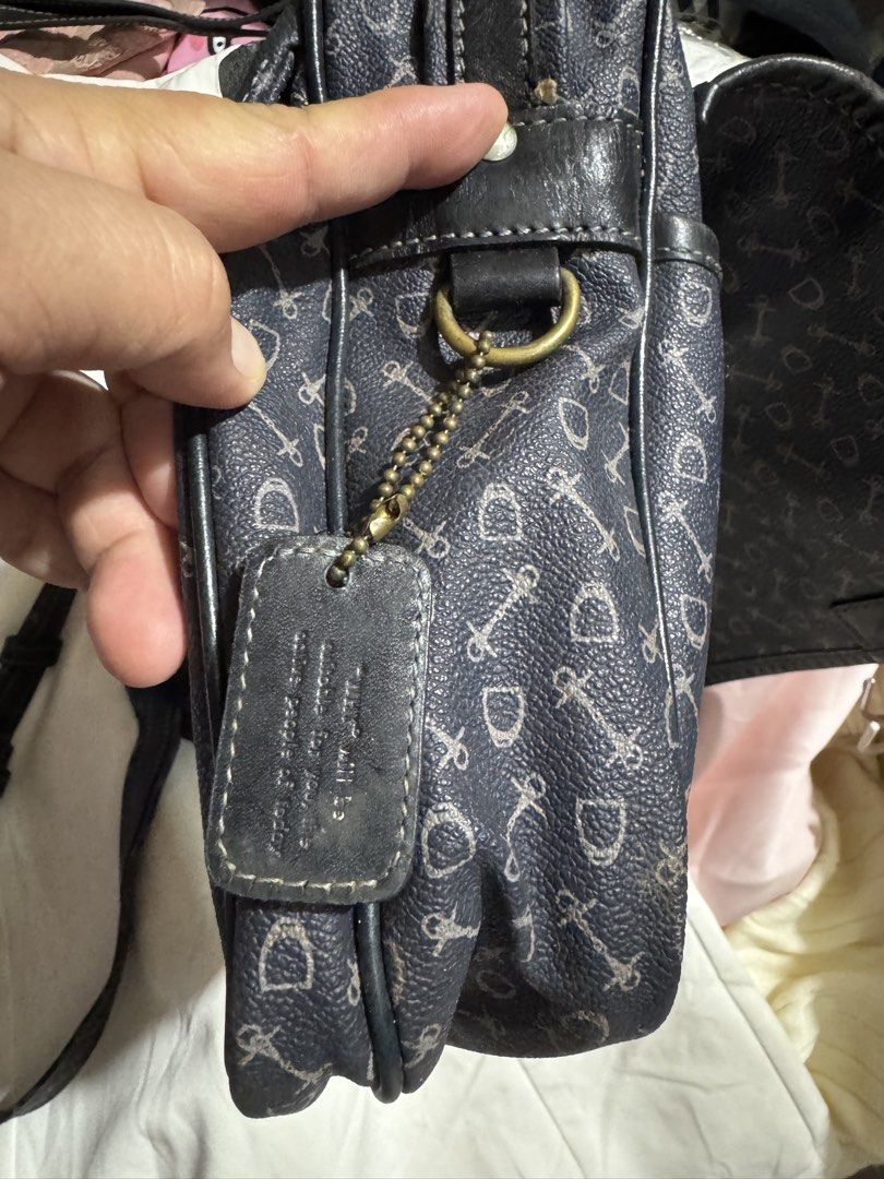 Crossbody bag why 100% leather (Category: Luxury Bags & Wallets) located in Manila. Submitted by wildbear.e10374 (Listing ID 1464735565, Image 3). Description: - Color/Design: Dark blue with allover horsebit print - Hardware: Brass tone with matching hanging debossed leather tag - Closure: Secure flap with snap buttons - Strap: Adjustable for custom fit - Interior: Fabric lining, zippered pocket, and inner gold branding plate - Condition: Minor w