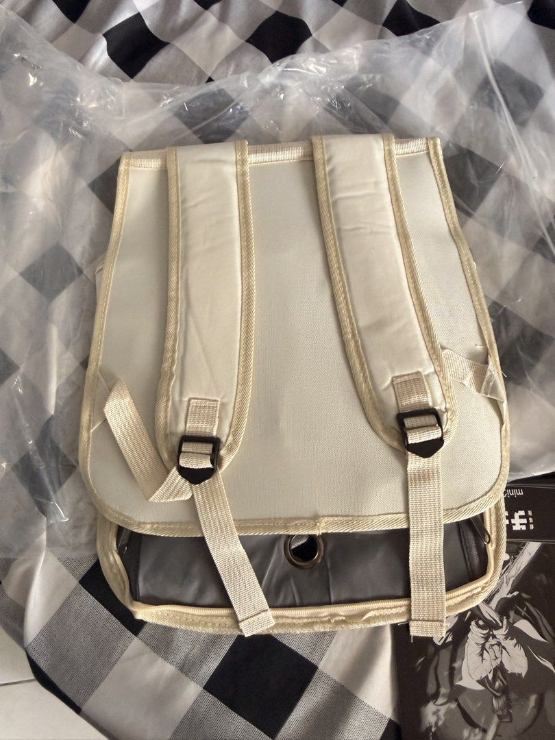 Cute Cat Face Pet Carrier Backpack for Small Animals (Category: Backpacks) located in Manila. Submitted by ellede32655 (Listing ID 1464618790, Image 3). Description: - Cream-colored pet carrier backpack - Features a clear front window with a cute cat face design - Zips open for easy pet access - Adjustable straps for comfortable carrying - Ideal for small pets on the go - Approximately 13 inches tall.