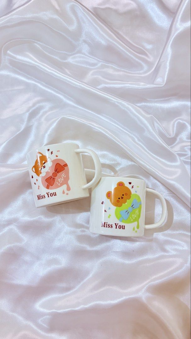 Cute Ceramic Mugs - 189 each (Category: Coffee & Tea Tableware) located in Manila. Submitted by declutteringmyclosetttt (Listing ID 1464584380, Image 3). Description: - Adorable ceramic mugs perfect for your favorite hot beverages. - Features cute animal designs like a bear and Shiba Inu. - Some mugs have sweet 'Miss You' and 'Love' text. - Also available in plain pastel colors with stylish lilac or orange handles. - Ideal for coffee, tea, or hot