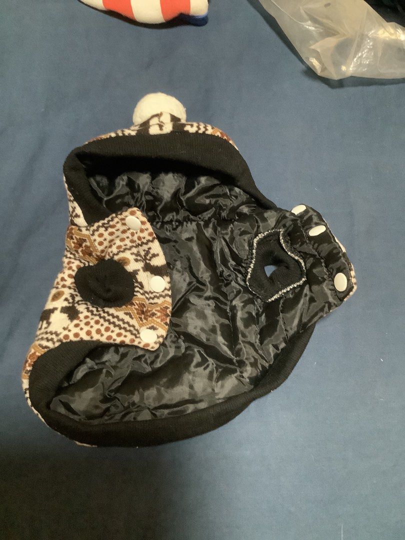 Cute Dog Coat with Reindeer Pattern and Pom Pom (Category: Homes & Other Pet Accessories) located in Las Pinas. Submitted by nanamerch (Listing ID 1464640022, Image 3). Description: - XS size -Adorable dog coat for your furry friend - Festive reindeer and geometric pattern - Cute pom pom on the hood - Lined with black satin-like material - Easy snap button closure - Keeps pets warm and stylish in colder weather.