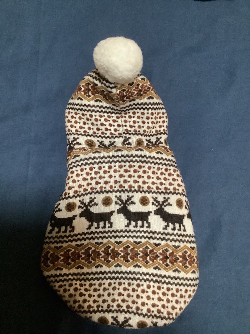 Cute Dog Coat with Reindeer Pattern and Pom Pom (Category: Homes & Other Pet Accessories) located in Las Pinas. Submitted by nanamerch (Listing ID 1464640022, Image 2). Description: - XS size -Adorable dog coat for your furry friend - Festive reindeer and geometric pattern - Cute pom pom on the hood - Lined with black satin-like material - Easy snap button closure - Keeps pets warm and stylish in colder weather.