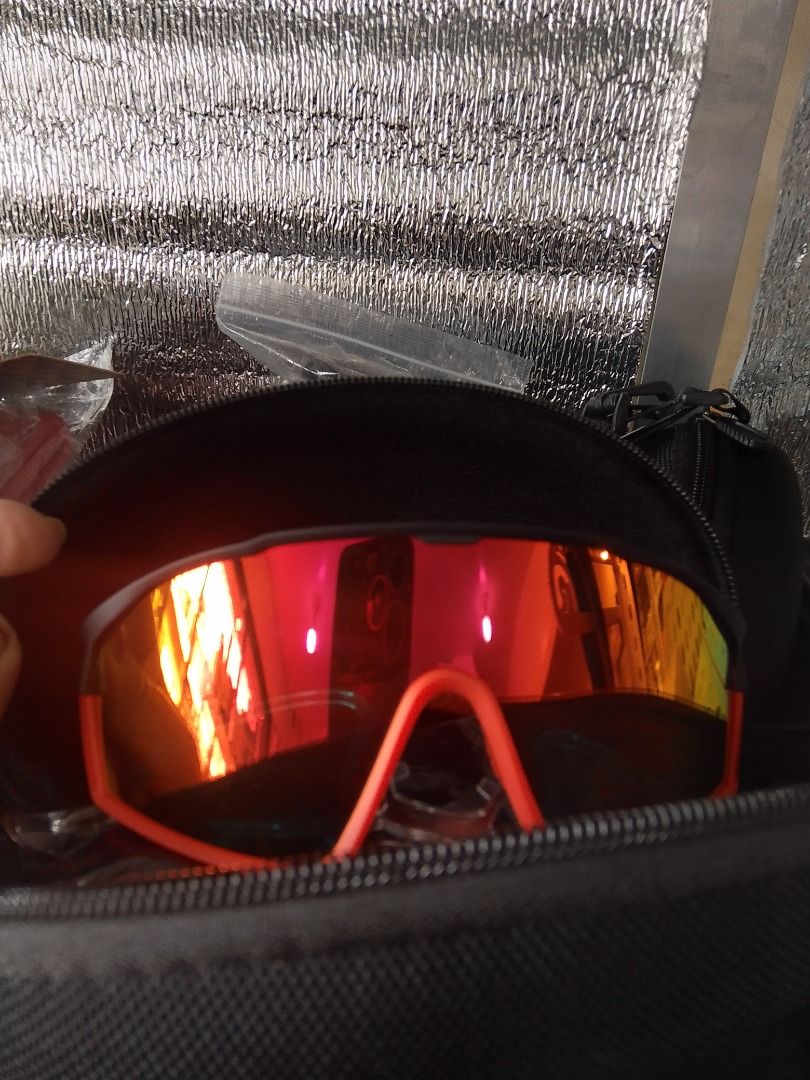 Rush sale!! (Category: Sunglasses & Eyewear) located in Caloocan City. Submitted by luckyturtle.aa6ccf (Listing ID 1464602460, Image 3). Description: - Bright orange frame - Reflective lenses - Perfect for cycling and outdoor sports - Includes a protective hard case - Soft pouch included inside the case - Ready for your next adventure!.