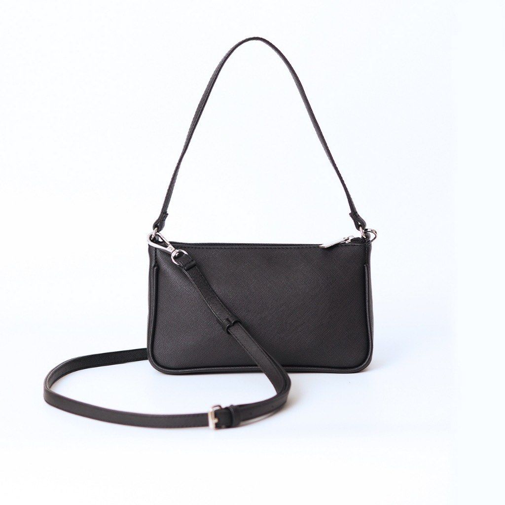 Daily Carry Black Shoulder Bag (Category: Shoulder Bags) located in Quezon City. Submitted by khsells (Listing ID 1464605759, Image 1). Description: - Classic black shoulder bag - Main zip compartment for secure storage - Detachable and adjustable long strap - Versatile: wear as a shoulder bag or crossbody - Simple, elegant design for everyday use.