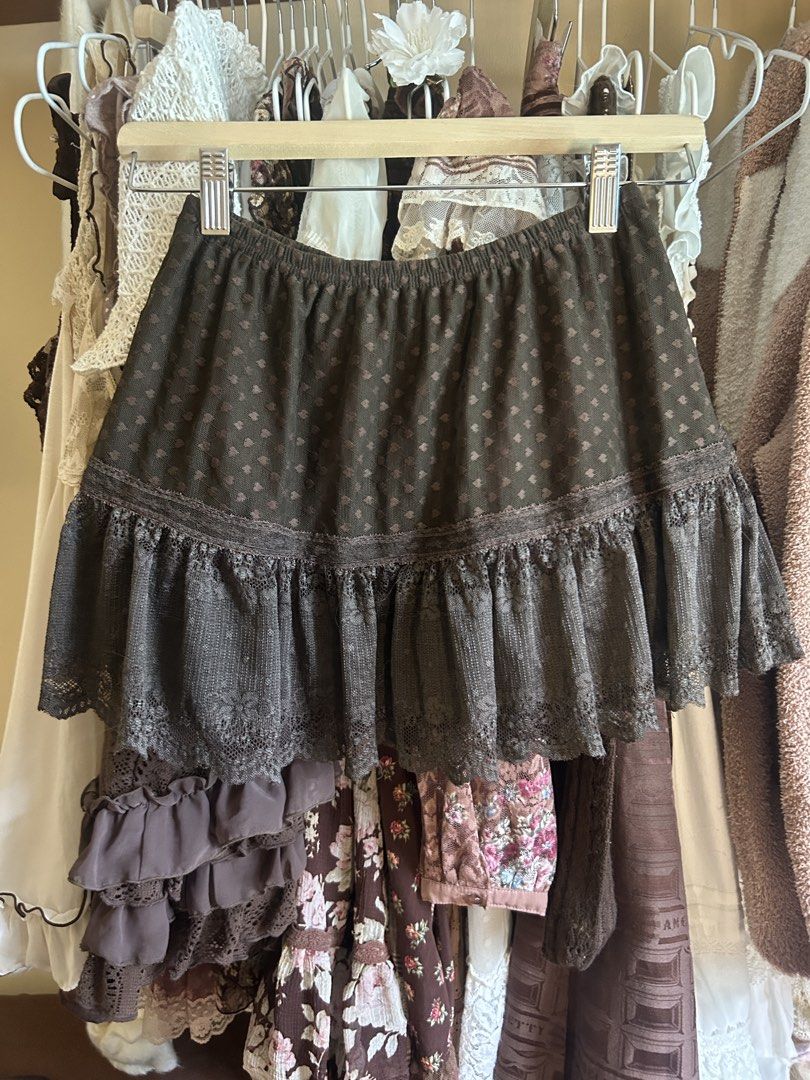 Dark brown skirt (Category: Skirts) located in Manila. Submitted by himeskaila (Listing ID 1464603375, Image 1). Description: Brown skirt with heart pattern and lace trim. Not Liz Lisa.