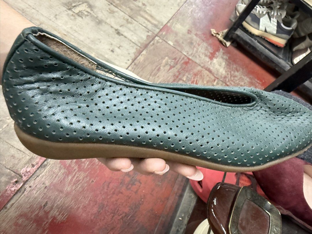 Dark Green Perforated Leather Slip-On Flats (Category: Flats & Sandals) located in Manila. Submitted by fastlion.584bdf (Listing ID 1464733507, Image 3). Description: - Color: Versatile dark green - Material: Soft leather with all-over perforated holes for maximum breathability - Design: Foldable and slip-on style, perfect for travel and easy packing - Sole: Flat rubber sole for all-day walking comfort - Style: Minimalist look that pairs effortle
