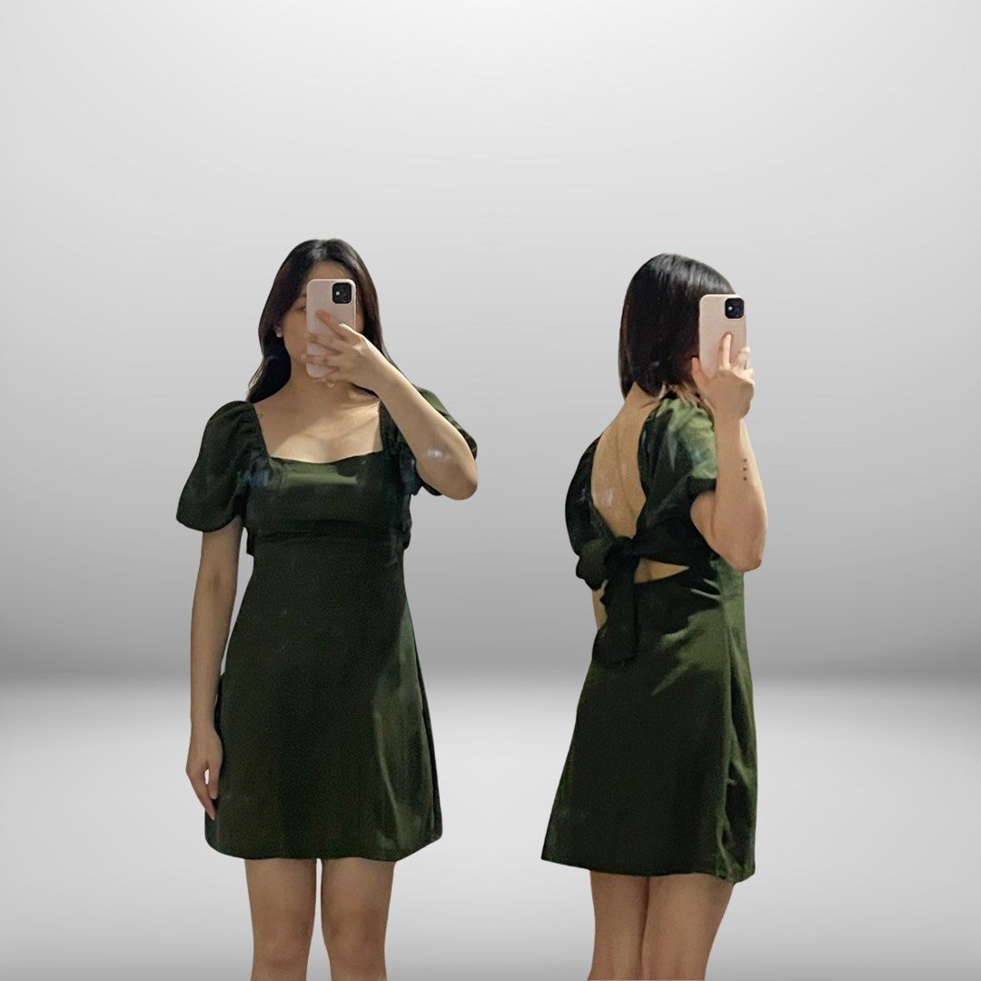 Dark Green Square Neck Mini Dress with Open Back (Category: Dresses) located in Angeles City. Submitted by slay.the.day (Listing ID 1464725248, Image 1). Description: - Color: Dark Green - Length: Mini (falls above the knee) - Design: Square neckline, short puff sleeves, and open back with tie ribbon detail - Fabric: Smooth with a subtle sheen - Style: Cute and chic, perfect for dates, cafe hopping, or day outs - USED ONLY TWICE.