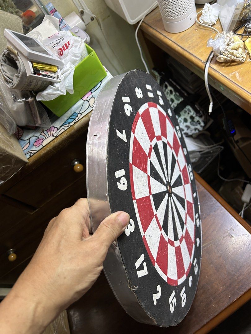 Dartboard with 6 Darts (Category: Action & Battle Toys) located in Caloocan City. Submitted by guitara1822 (Listing ID 1464662344, Image 3). Description: - Standard dartboard with numbers - Includes 6 darts (3 red, 3 yellow) - Board has some wear on the edges - Ideal for game nights or target practice.
