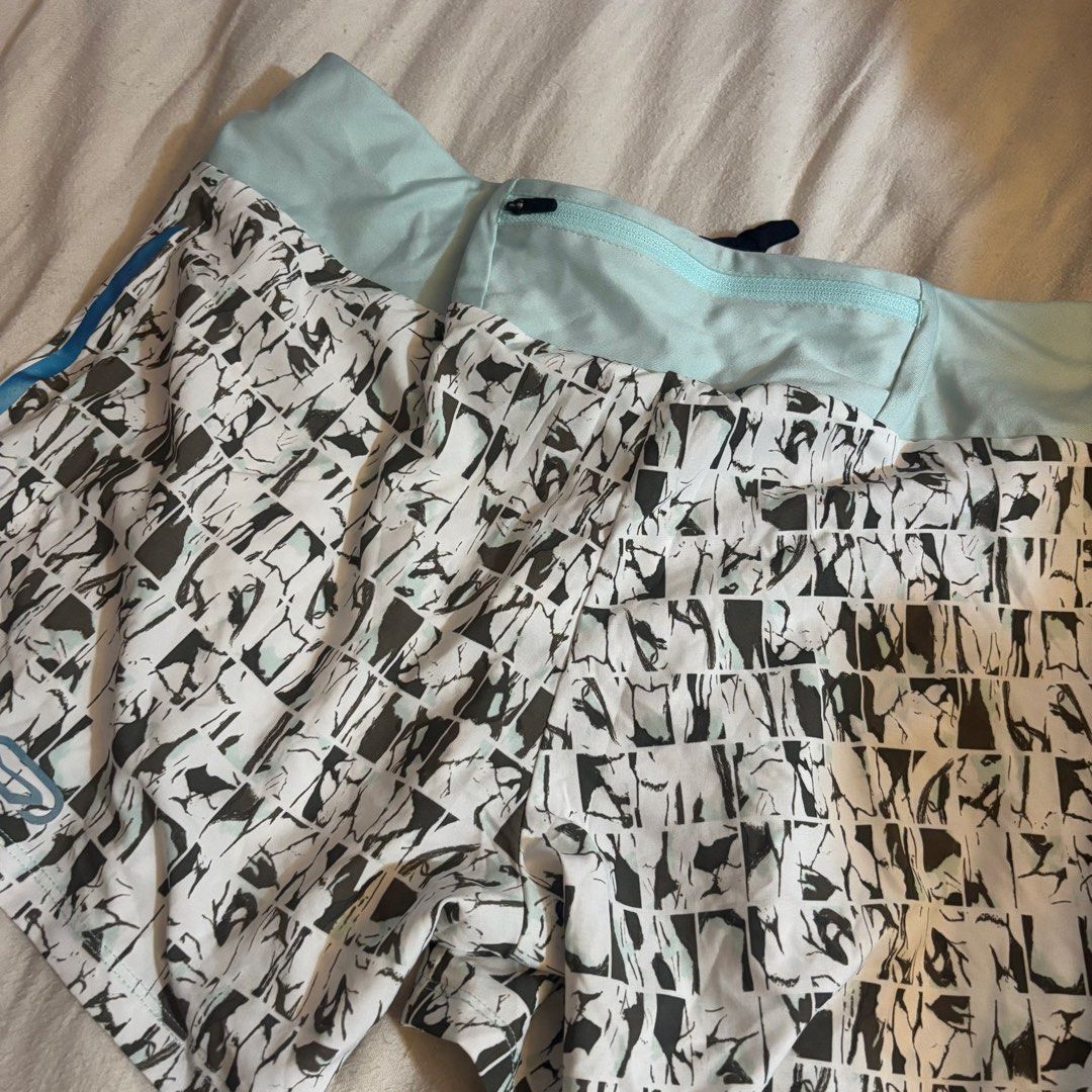 Decathlon Running Shorts - Size S (Category: Activewear) located in Cainta. Submitted by kairus.luckyfind (Listing ID 1464644417, Image 2). Description: - Brand: Decathlon - Color: Light blue and white pattern - Style: Running shorts - Features: Elastic waistband, small zippered pocket at the back - Material: Lightweight and breathable - Size: S - Perfect for: Workouts or casual wear.