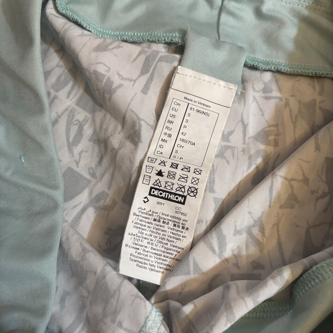 Decathlon Running Shorts - Size S (Category: Activewear) located in Cainta. Submitted by kairus.luckyfind (Listing ID 1464644417, Image 3). Description: - Brand: Decathlon - Color: Light blue and white pattern - Style: Running shorts - Features: Elastic waistband, small zippered pocket at the back - Material: Lightweight and breathable - Size: S - Perfect for: Workouts or casual wear.