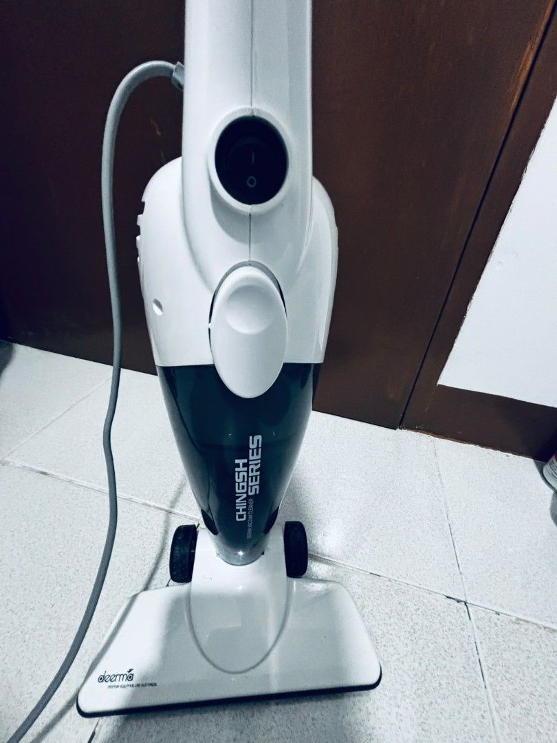 Deerma Handheld Vacuum Cleaner (Category: Vacuum Cleaner & Housekeeping) located in Dasmarinas. Submitted by titaniumrosegold (Listing ID 1464607342, Image 1). Description: - Deerma handheld vacuum cleaner - Color: White and dark grey - Power type: Corded electric - Ideal for quick cleanups - Fully functional, works well rfs decluttering.